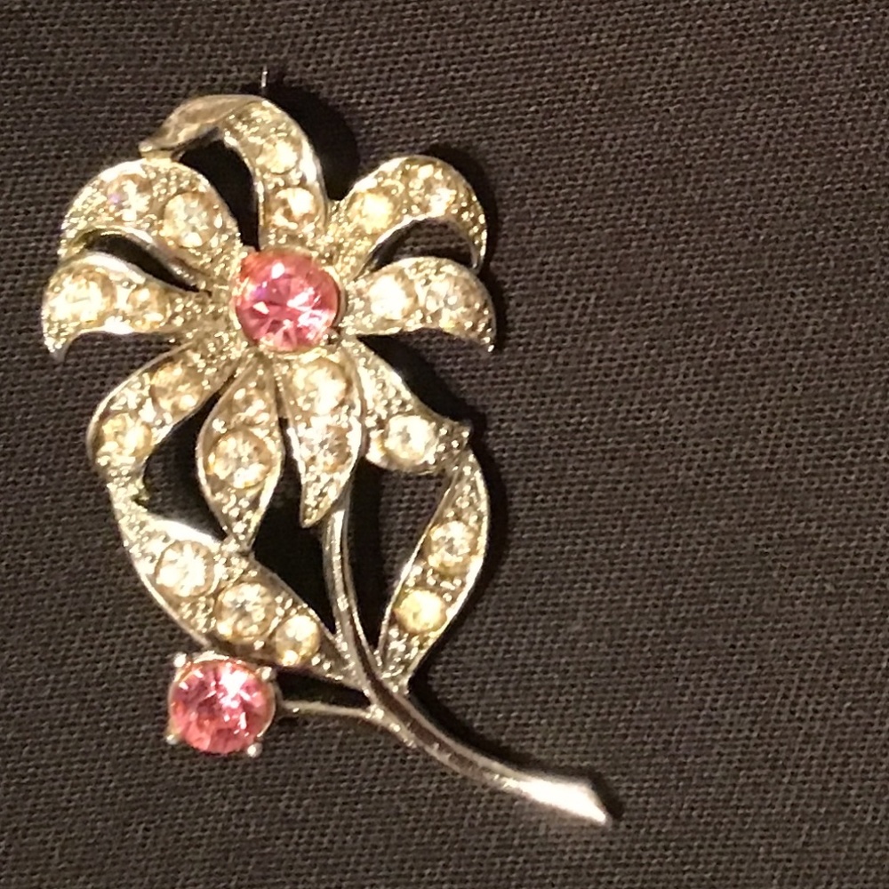 Vintage silvertone brooch with clear rhinestones accented with 2 pink stones
